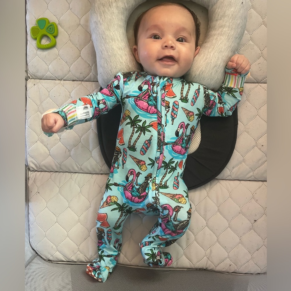 Bums and Roses bamboo footie in size 3-6 months